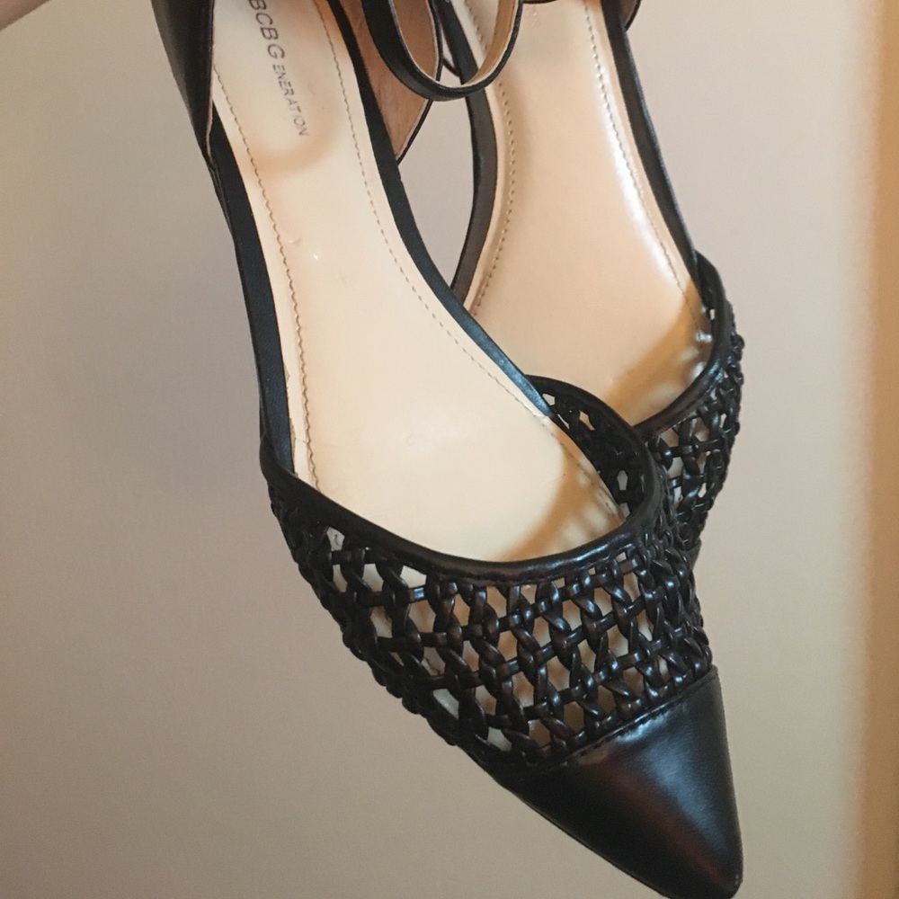 Black woven flats with an ankle strap